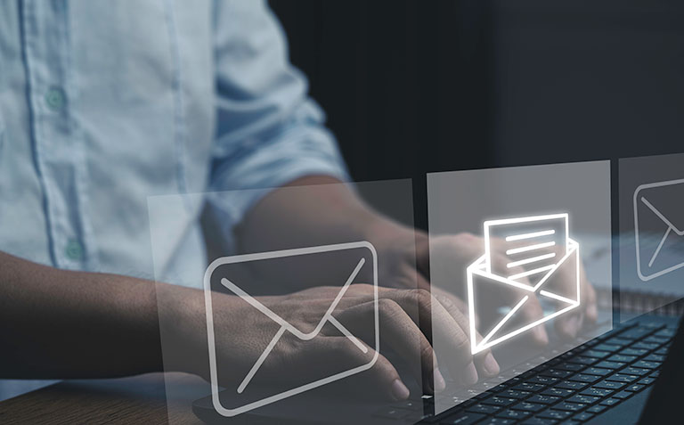 Close up of male doctor typing on a laptop